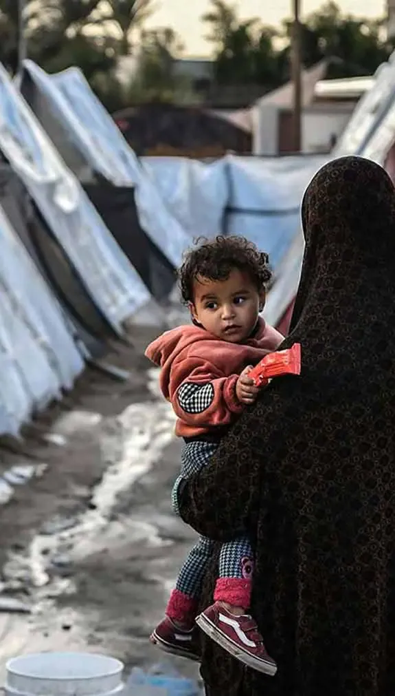 Woman and child in refugee camp in Gaza.