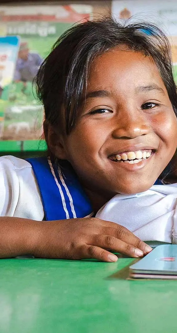 Len Sokha, 10, and her best friend Sok Na in the school library