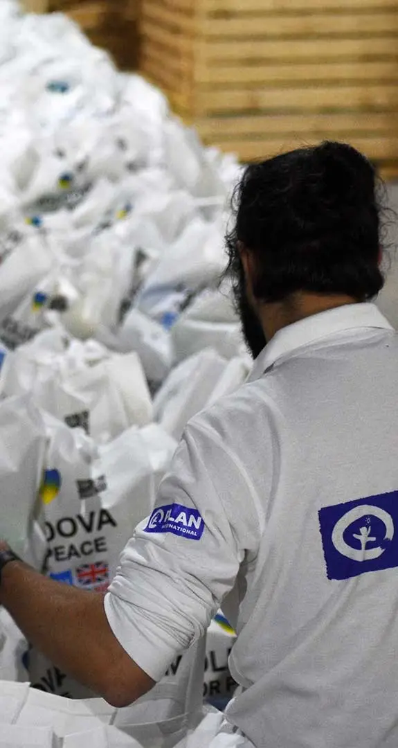 A volunteer unloads food in Moldova as part of the response to the crisis in Ukraine.
